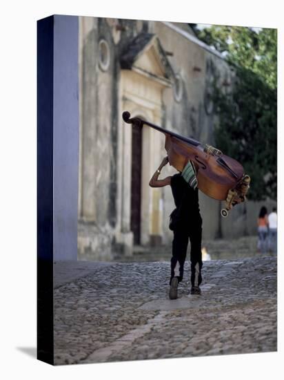 Musician Carrying Double Bass Along Cobbled Street to Plaza Mayor, Trinidad, Cuba-Lee Frost-Stretched Canvas