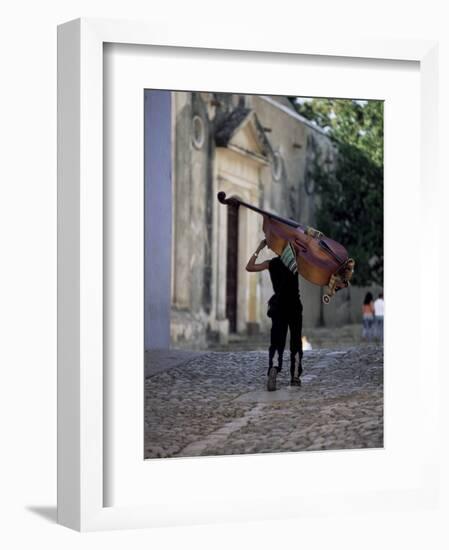 Musician Carrying Double Bass Along Cobbled Street to Plaza Mayor, Trinidad, Cuba-Lee Frost-Framed Photographic Print