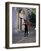 Musician Carrying Double Bass Along Cobbled Street to Plaza Mayor, Trinidad, Cuba-Lee Frost-Framed Photographic Print