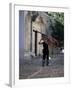 Musician Carrying Double Bass Along Cobbled Street to Plaza Mayor, Trinidad, Cuba-Lee Frost-Framed Photographic Print