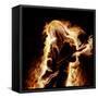 Musician With An Electronic Guitar Enveloped In Flames On A Black Background-Sergey Nivens-Framed Stretched Canvas