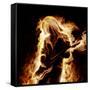 Musician With An Electronic Guitar Enveloped In Flames On A Black Background-Sergey Nivens-Framed Stretched Canvas