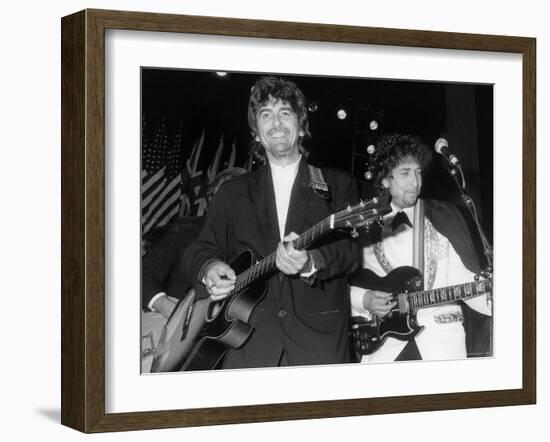 Musicians George Harrison and Bob Dylan Performing at Rock and Roll Hall of Fame-David Mcgough-Framed Premium Photographic Print