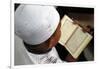 Muslim boy learning Quran at Islamic school, with Kufi hat-Godong-Framed Photographic Print