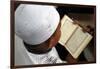 Muslim boy learning Quran at Islamic school, with Kufi hat-Godong-Framed Photographic Print