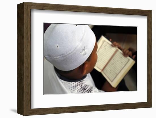 Muslim boy learning Quran at Islamic school, with Kufi hat-Godong-Framed Photographic Print