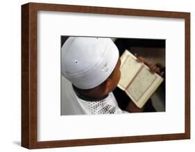 Muslim boy learning Quran at Islamic school, with Kufi hat-Godong-Framed Photographic Print