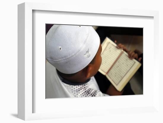 Muslim boy learning Quran at Islamic school, with Kufi hat-Godong-Framed Photographic Print