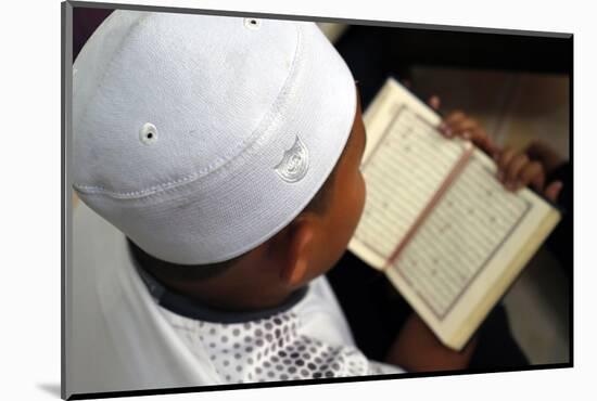 Muslim boy learning Quran at Islamic school, with Kufi hat-Godong-Mounted Photographic Print