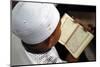 Muslim boy learning Quran at Islamic school, with Kufi hat-Godong-Mounted Photographic Print