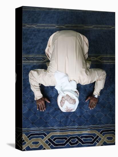 Muslim Man Praying, Dubai, United Arab Emirates, Middle East-null-Stretched Canvas