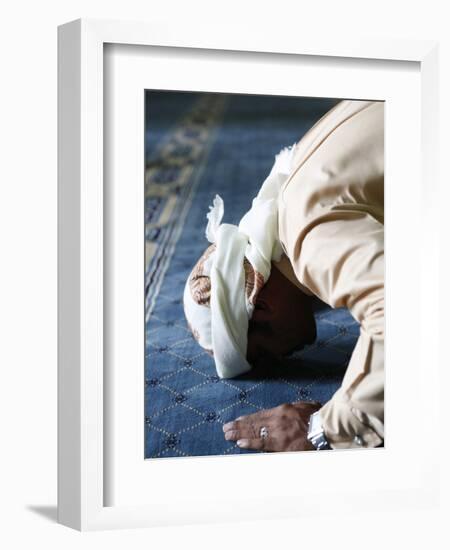 Muslim Man Praying, Dubai, United Arab Emirates, Middle East-null-Framed Photographic Print