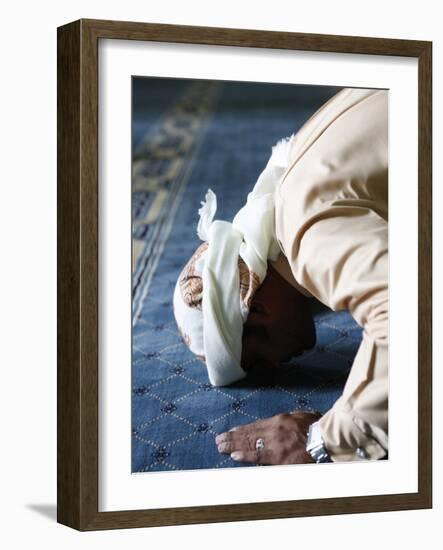 Muslim Man Praying, Dubai, United Arab Emirates, Middle East-null-Framed Photographic Print