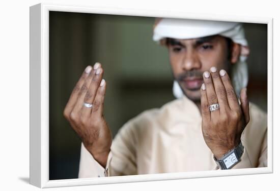 Muslim man praying, Dubai, United Arab Emirates-Godong-Framed Photographic Print