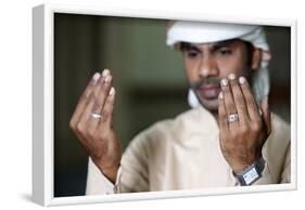 Muslim man praying, Dubai, United Arab Emirates-Godong-Framed Photographic Print