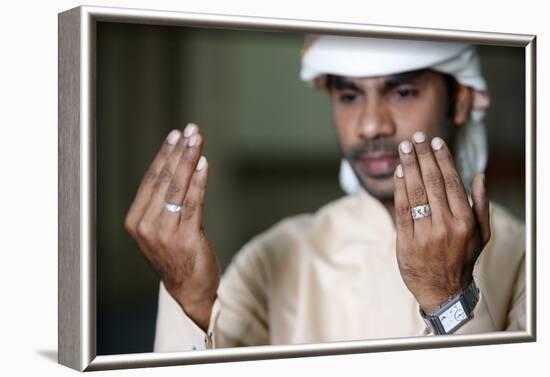 Muslim man praying, Dubai, United Arab Emirates-Godong-Framed Photographic Print