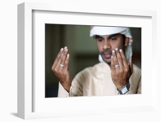 Muslim man praying, Dubai, United Arab Emirates-Godong-Framed Photographic Print