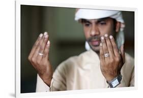 Muslim man praying, Dubai, United Arab Emirates-Godong-Framed Photographic Print