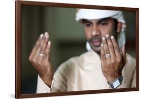 Muslim man praying, Dubai, United Arab Emirates-Godong-Framed Photographic Print