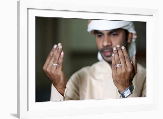 Muslim man praying, Dubai, United Arab Emirates-Godong-Framed Photographic Print