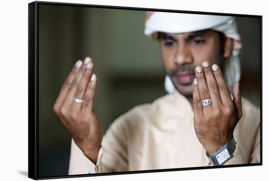 Muslim man praying, Dubai, United Arab Emirates-Godong-Framed Stretched Canvas