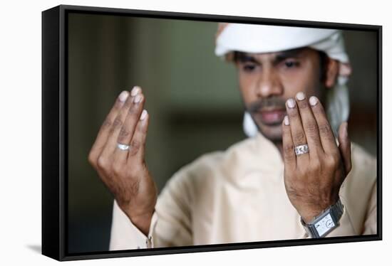 Muslim man praying, Dubai, United Arab Emirates-Godong-Framed Stretched Canvas