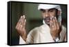 Muslim man praying, Dubai, United Arab Emirates-Godong-Framed Stretched Canvas