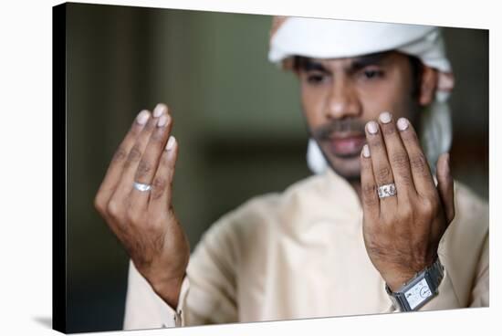 Muslim man praying, Dubai, United Arab Emirates-Godong-Stretched Canvas