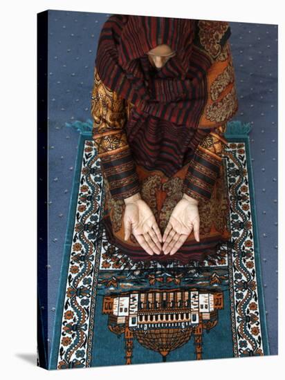 Muslim Woman Kneeling on Prayer Mat Saying Prayers, Jordan, Middle East-null-Stretched Canvas