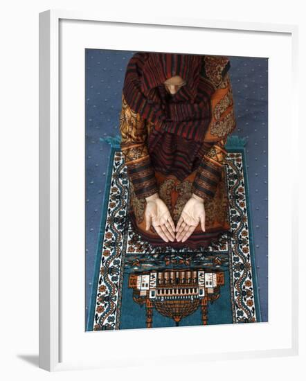 Muslim Woman Kneeling on Prayer Mat Saying Prayers, Jordan, Middle East-null-Framed Photographic Print