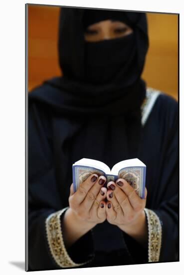 Muslim woman reading the Noble Quran, United Arab Emirates, Middle East-Godong-Mounted Photographic Print