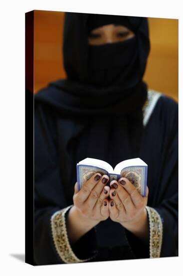 Muslim woman reading the Noble Quran, United Arab Emirates, Middle East-Godong-Stretched Canvas