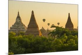 Myanmar. Bagan. Hot Air Balloons Rising over the Temples of Bagan-Inger Hogstrom-Mounted Photographic Print