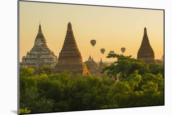 Myanmar. Bagan. Hot Air Balloons Rising over the Temples of Bagan-Inger Hogstrom-Mounted Photographic Print