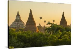 Myanmar. Bagan. Hot Air Balloons Rising over the Temples of Bagan-Inger Hogstrom-Stretched Canvas