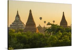 Myanmar. Bagan. Hot Air Balloons Rising over the Temples of Bagan-Inger Hogstrom-Stretched Canvas