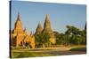 Myanmar. Bagan. Red Brick Temple Glows in the Late Afternoon Light-Inger Hogstrom-Stretched Canvas