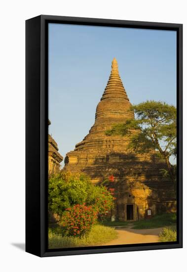 Myanmar. Bagan. Red Brick Temple Glows in the Late Afternoon Light-Inger Hogstrom-Framed Stretched Canvas