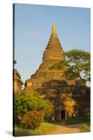 Myanmar. Bagan. Red Brick Temple Glows in the Late Afternoon Light-Inger Hogstrom-Stretched Canvas