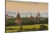 Myanmar. Bagan. Sunset over the Temples of Bagan-Inger Hogstrom-Stretched Canvas