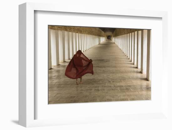 Myanmar, Bagan. Young Monk Walks the Hallway of Shwezigon Monastery in Bagan-Brenda Tharp-Framed Photographic Print