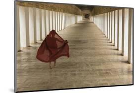 Myanmar, Bagan. Young Monk Walks the Hallway of Shwezigon Monastery in Bagan-Brenda Tharp-Mounted Photographic Print