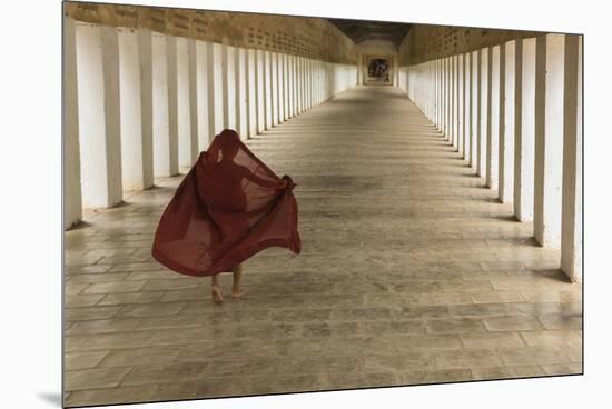 Myanmar, Bagan. Young Monk Walks the Hallway of Shwezigon Monastery in Bagan-Brenda Tharp-Mounted Premium Photographic Print