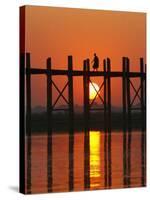 Myanmar (Burma), Amarapura, Taungthaman Lake, U Bein's Bridge, a Monk Walking Home at Sunset-Katie Garrod-Stretched Canvas