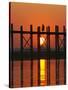 Myanmar (Burma), Amarapura, Taungthaman Lake, U Bein's Bridge, a Monk Walking Home at Sunset-Katie Garrod-Stretched Canvas