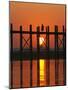 Myanmar (Burma), Amarapura, Taungthaman Lake, U Bein's Bridge, a Monk Walking Home at Sunset-Katie Garrod-Mounted Photographic Print