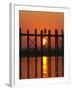 Myanmar (Burma), Amarapura, Taungthaman Lake, U Bein's Bridge, a Monk Walking Home at Sunset-Katie Garrod-Framed Photographic Print