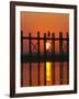 Myanmar (Burma), Amarapura, Taungthaman Lake, U Bein's Bridge, a Monk Walking Home at Sunset-Katie Garrod-Framed Photographic Print