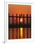 Myanmar (Burma), Amarapura, Taungthaman Lake, U Bein's Bridge, a Monk Walking Home at Sunset-Katie Garrod-Framed Photographic Print