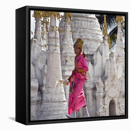 Myanmar, Burma, Lake Inle, A Young Novitiate Passes an Ornate Buddhist Shrine-Nigel Pavitt-Framed Stretched Canvas